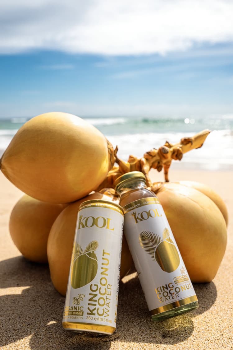 Kool King Coconut Water products on a tropical beach with king coconuts